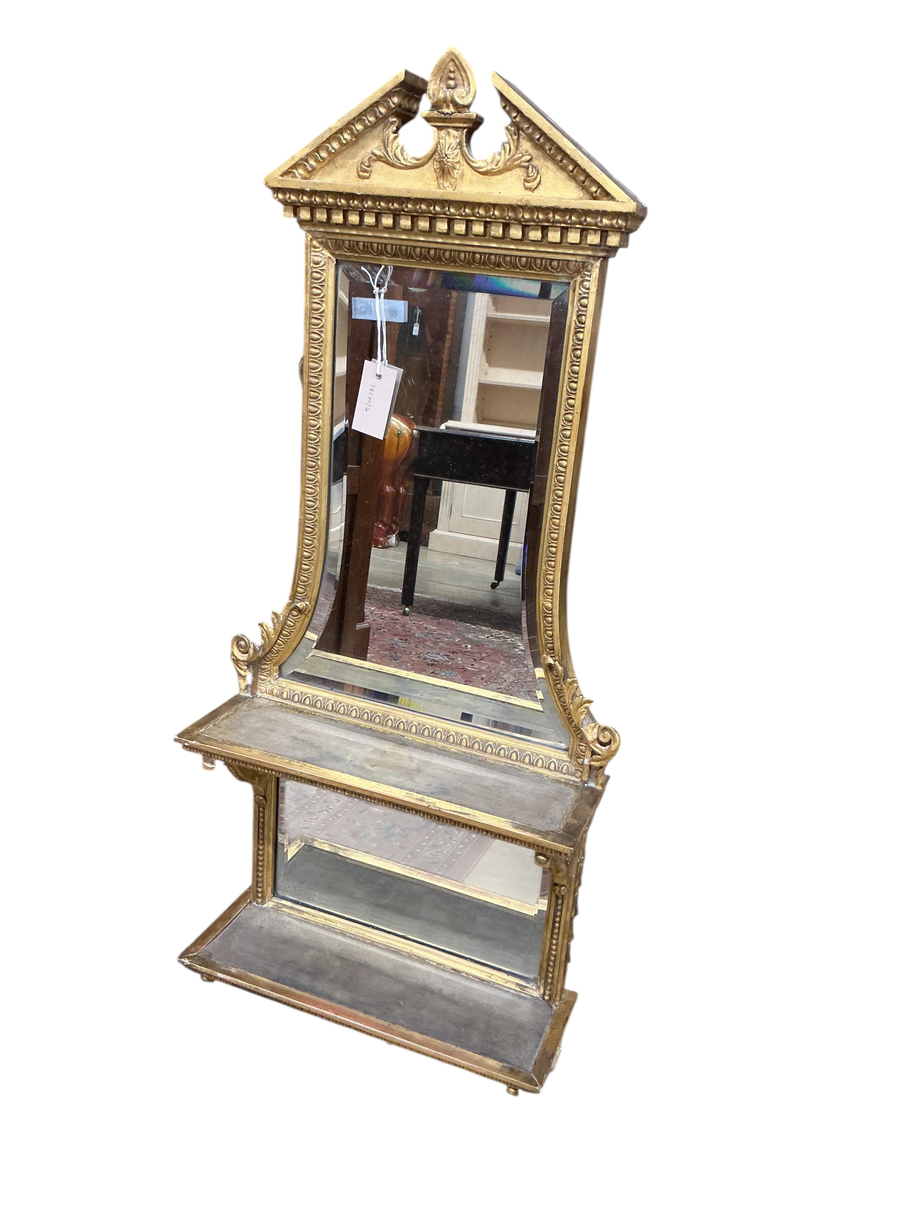 A 19th century giltwood and composition mirrored two tier wall bracket, width 44cm, height 108cm
